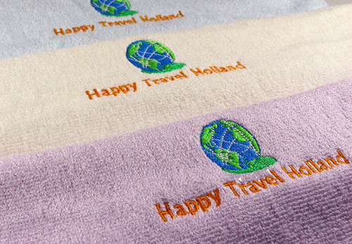ผ้าขนหนูใยไผ่ปักโลโก้ happy travel Holland